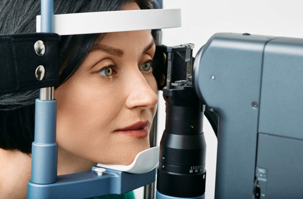 A close-up of a patient receiving a slit lamp examination to check for any underlying health conditions during their routine eye exam.